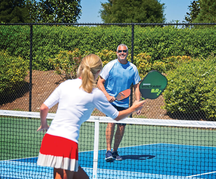 members playing pickleball